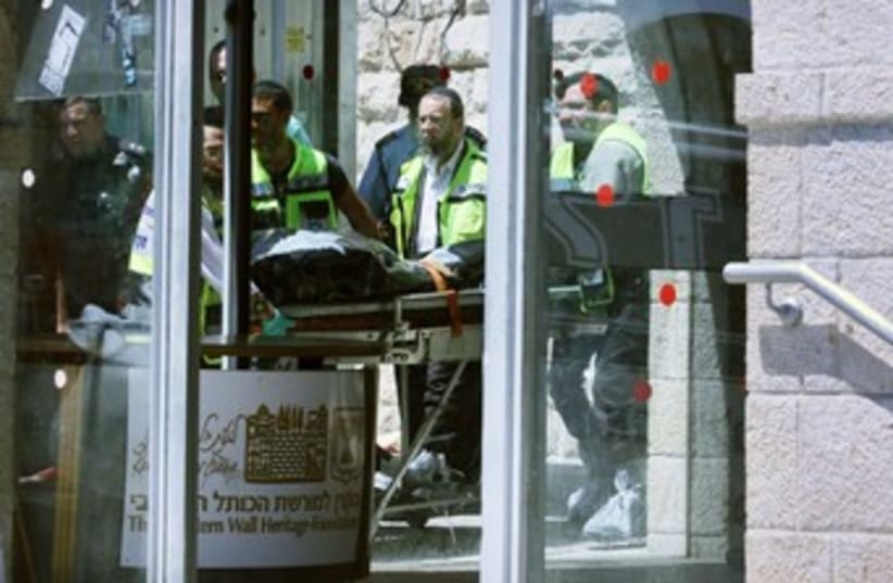 bodybag of J'lem Kotel shooting 370 (photo credit: Marc Israel Sellem/The Jerusalem Post)