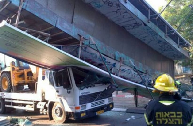 Bridge crushes truck 370 (photo credit: Courtesy MDA)