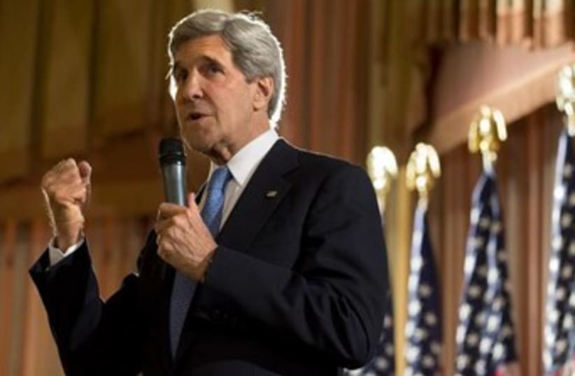US Secretary of State Kerry fist pump 370 (photo credit: Reuters)
