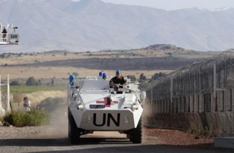 UN peacekeeping tank on golan heights 370 (photo credit: REUTERS)