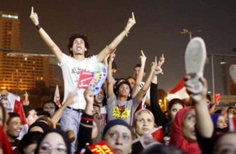 egypt protesters middle finger 370 (photo credit: REUTERS)