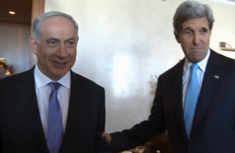 Kerry pulls Netanyahu by the arm 370 (photo credit: Matty Stern/US Embassy Tel Aviv)