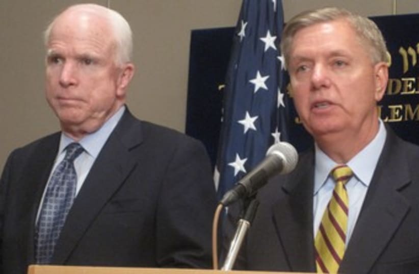 US SENATORS John McCain and Lindsey Graham address a news co (photo credit: STEVE LINDE)