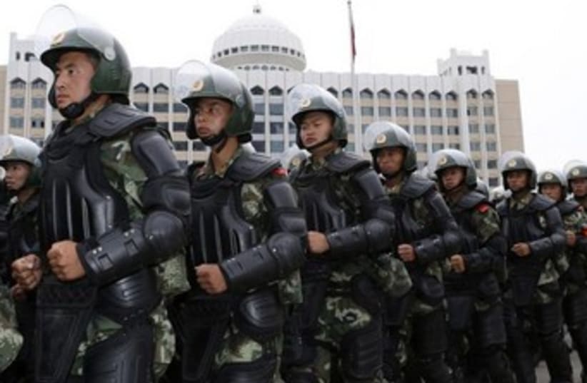 Armed chinese paramilitary policemen 370 (photo credit: REUTERS)