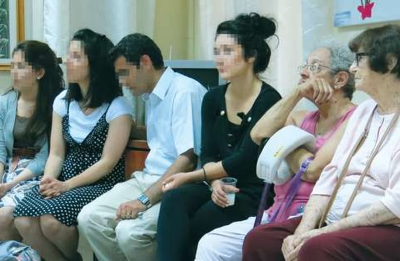 A group of young Iranians listen to a Holocaust survivor (photo credit: ESTERA WIEJA)