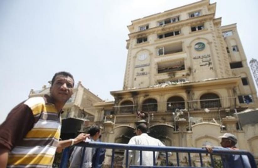 The ransacked Muslim Brotherhood building in Cairo 370 (photo credit: Reuters)
