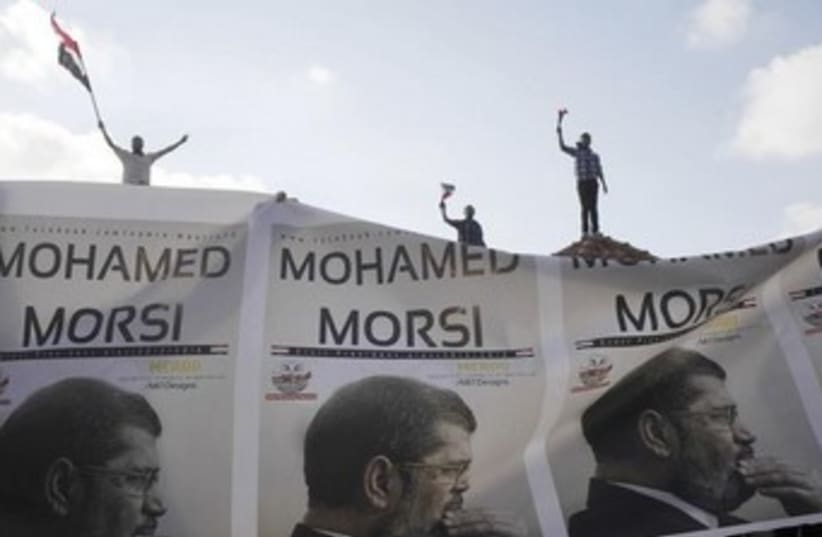 muslim brotherhood - morsi banners 370 (photo credit: REUTERS)