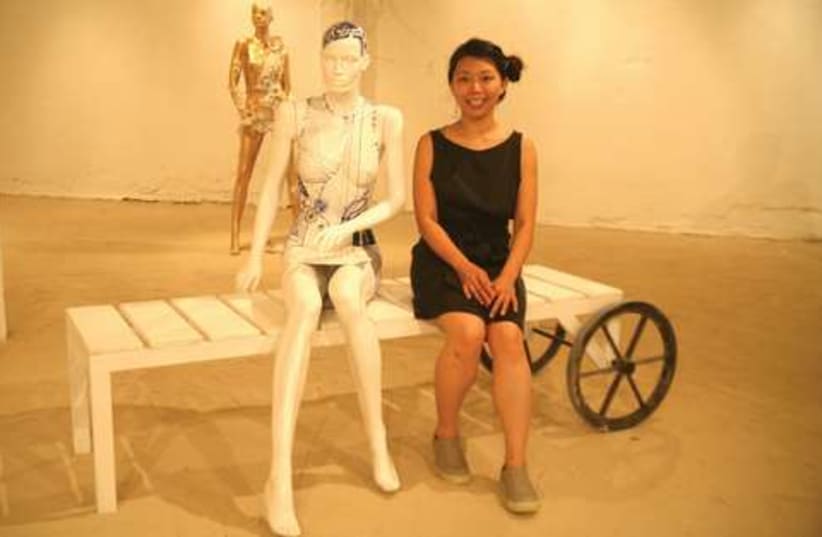 Gin Lee with her mannequin at the opening (photo credit: Daria Frost/ISRAEL21c)