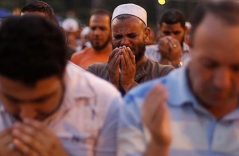 Morsi supporter cries 390 (photo credit: REUTERS)