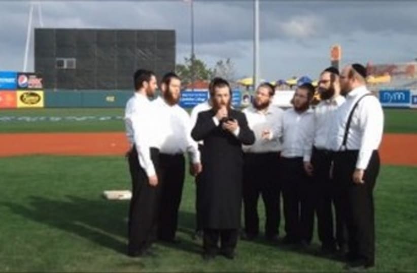 Hasidim sing at baseball game 370 (photo credit: JTA)