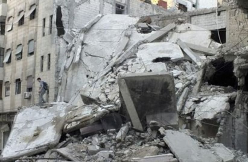Damage from fighting in Syria's Homs 370 (photo credit: REUTERS)