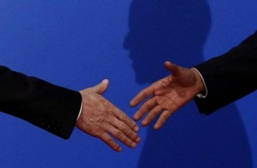 handshake 370 (photo credit: REUTERS)