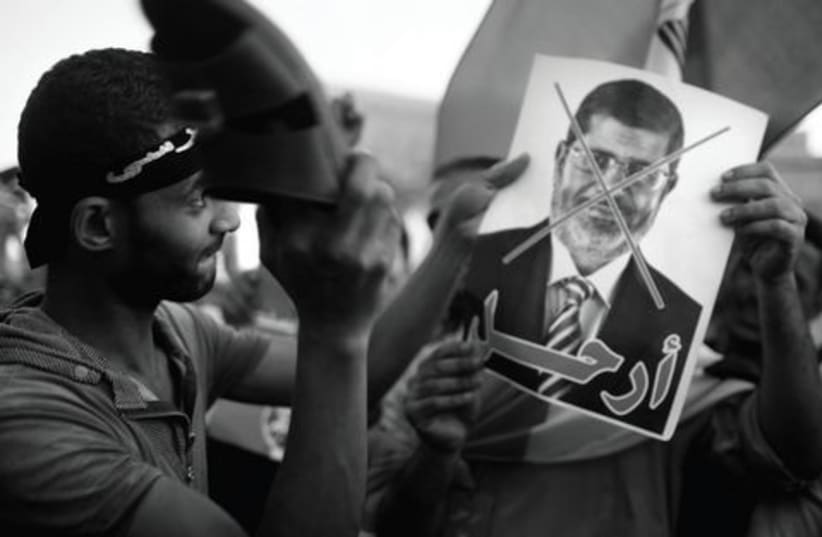 Morsi Protestors521 (photo credit: ASMAA WAGUIH/REUTERS)