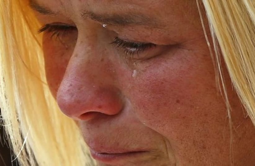 Woman weeping, crying, tear drop 521 (photo credit: REUTERS)