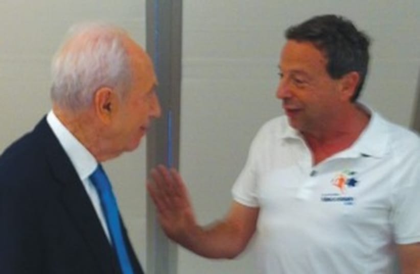 Peres meets with Maccabiah games chair Peled 370 (photo credit: Courtesy)
