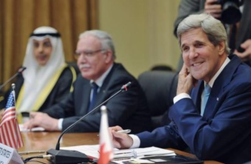 Kerry sits next to PA FM Malki at Arab League meet 370 (photo credit: REUTERS)