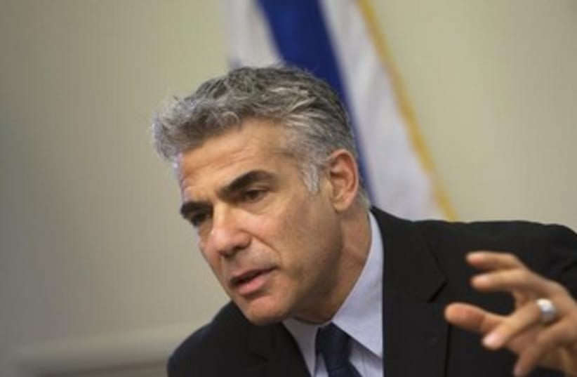 Finance Minister Yair Lapid 370 (photo credit: REUTERS)