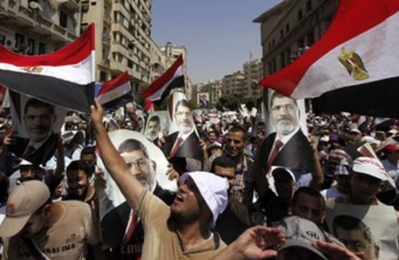 Morsi supporters with flags 370 (photo credit: REUTERS)