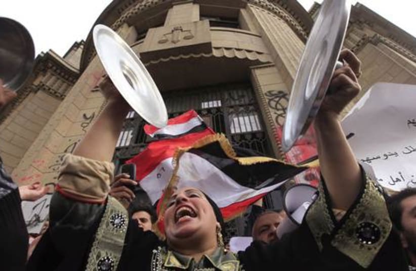 A woman protests about hunger and poverty in Cairo (photo credit: MOHAMED ABD EL GHANY / REUTERS)