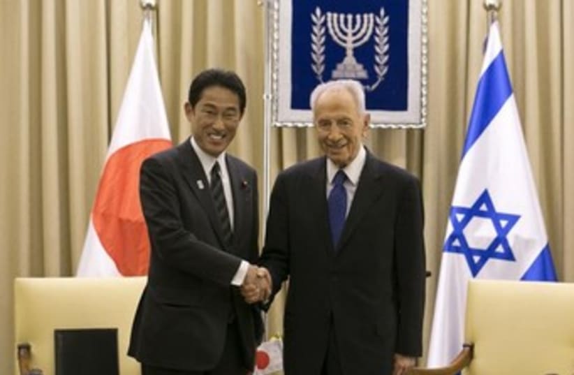 peres with japanese fm 370 (photo credit: REUTERS)