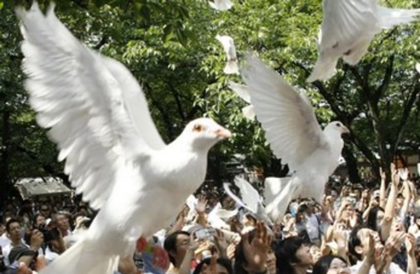 Doves flying 370 (photo credit: REUTERS)