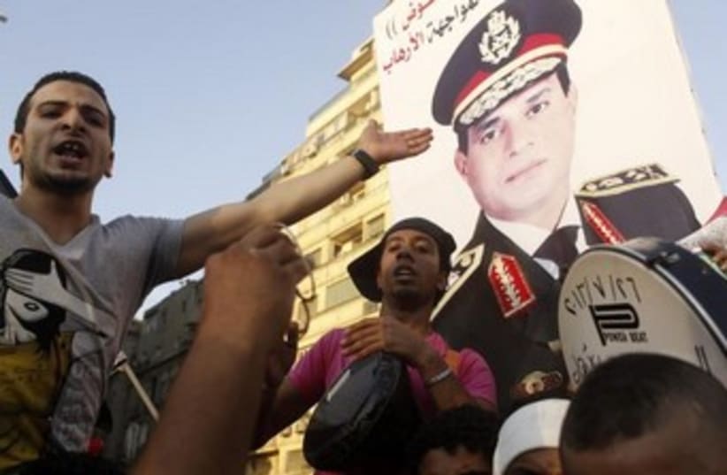 Anti-Morsi protesters with Sisi poster 370 (photo credit: REUTERS/Asmaa Waguih)