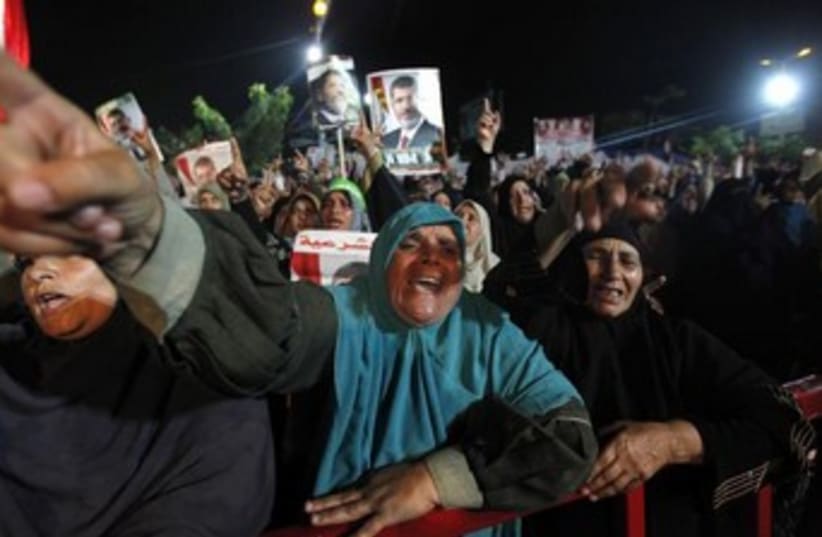 Female Morsi supporters yelling, pointing 370 (photo credit: REUTERS/Mohamed Abd El Ghany)