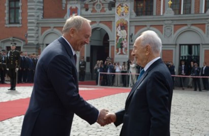 Israeli President Peres with Latvia President Riga (photo credit: GPO)