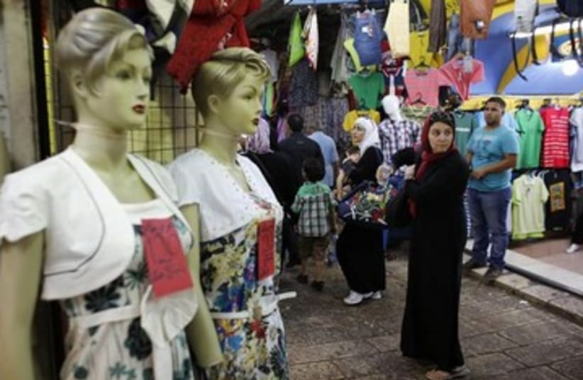 Palestinians shopping during Ramadan 390 (photo credit: REUTERS)