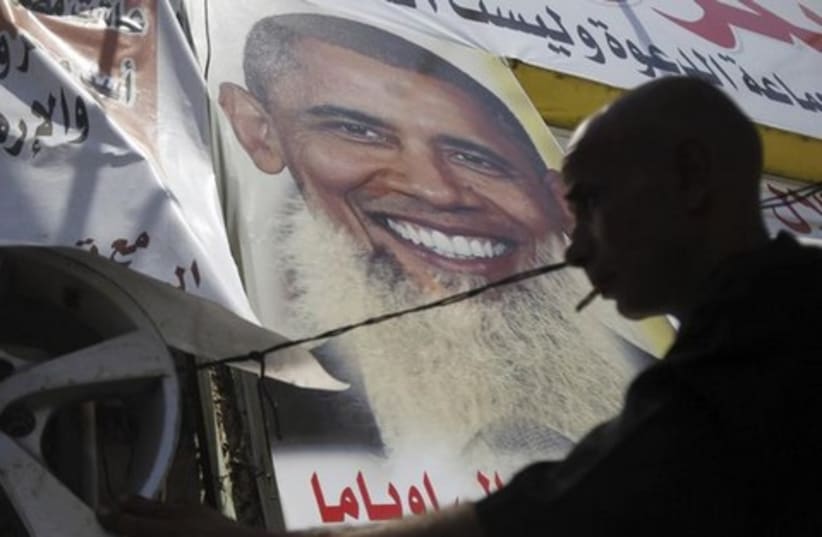 Poster depicting US president Barack Obama with a beard (photo credit: Reuters)