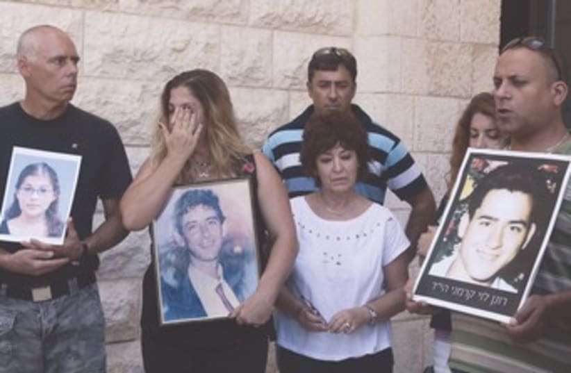 Bereaved families protest prisoner release outside Court 370 (photo credit: Marc Israel Sellem/The Jerusalem Post)