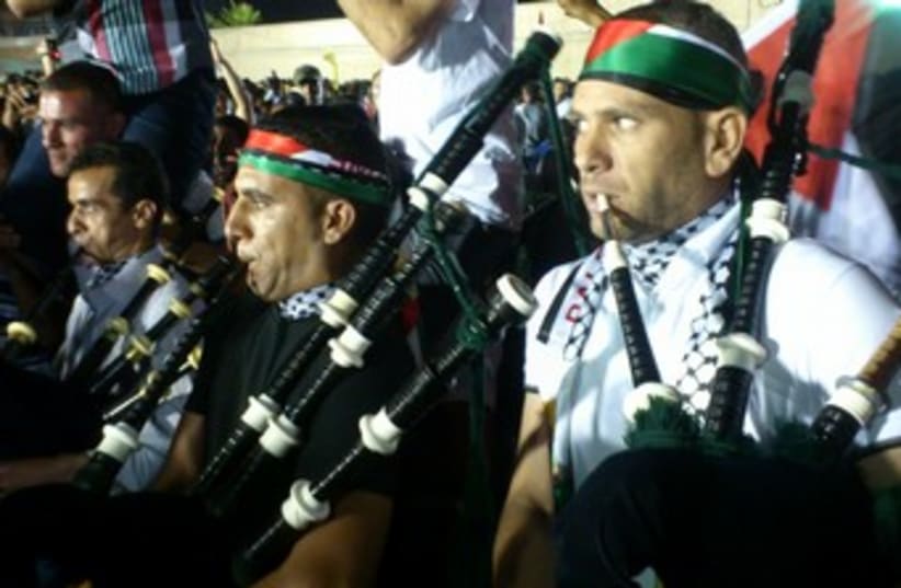 Palestinians celebrate prisoner release 370 (photo credit: Ben Hartman)