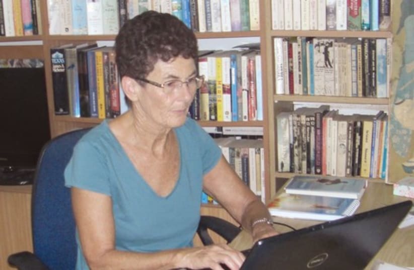 Beryl Belsky sits at her laptop 521 (photo credit: Courtesy)