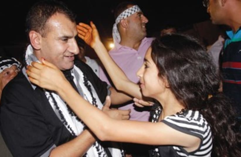 Freed Palestinian prisoner prisoner Hosni Sawalha 370 (photo credit: Abed Omar Qusini/Reuters)