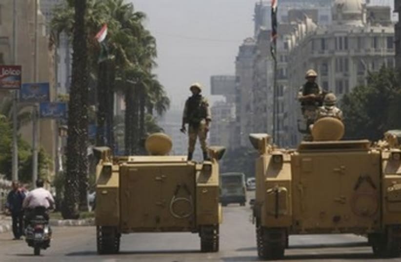 Egypt soldier on tank 370 (photo credit: REUTERS)