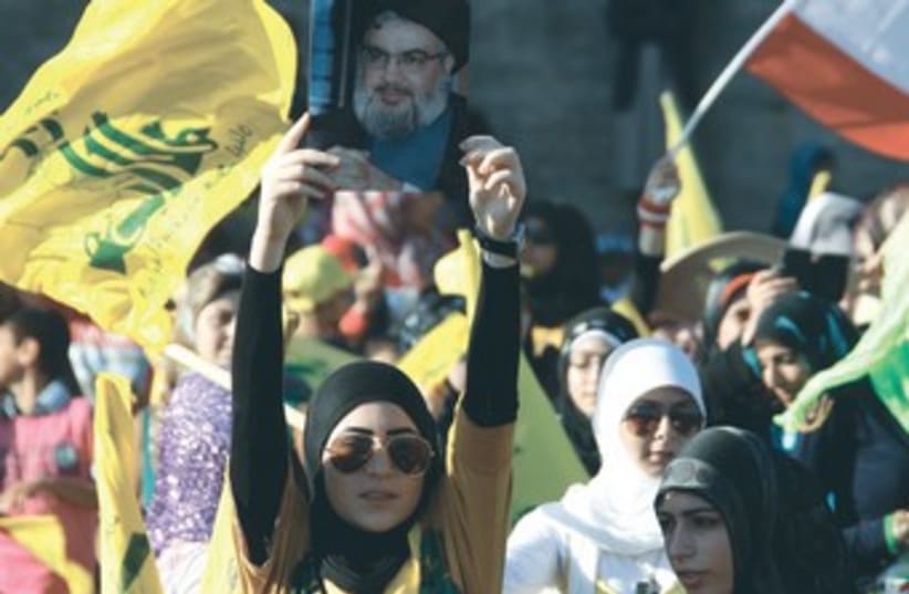 Hezbollah supporters rally in south Lebanon 350 (photo credit: REUTERS)