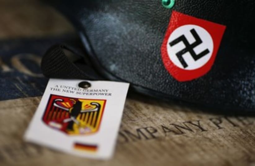 A motorcycle helmet with Nazi swastika sign for sale 370 (photo credit: reuters)