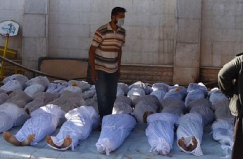 Bodies from Syria chemical weapons attack 370 (photo credit: REUTERS/Bassam Khabieh)