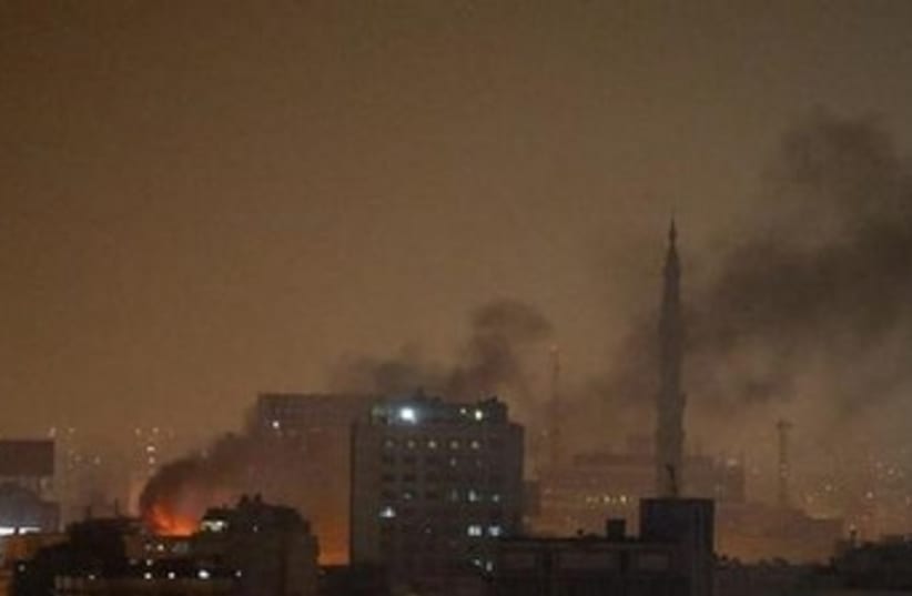 smoke rises at night in cairo 370 (photo credit: REUTERS)