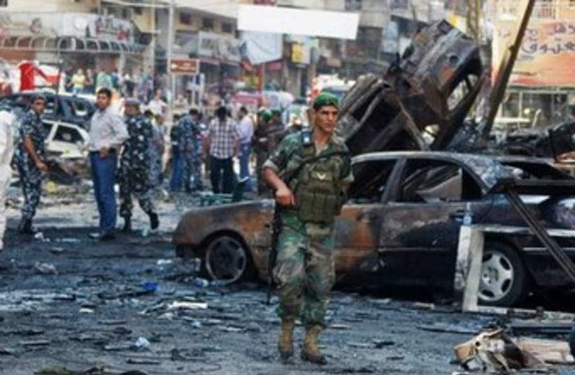 Lebanese soldier at blast site 370 (photo credit: REUTERS)