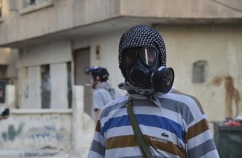Syiran gas mask 370 (photo credit: REUTERS/Bassam Khabieh )