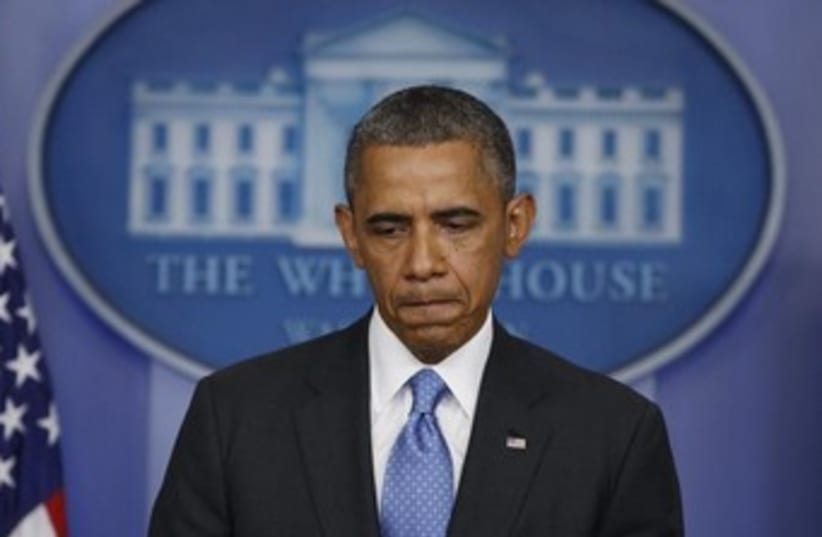Obama looking sad at White House 370 (photo credit: REUTERS)