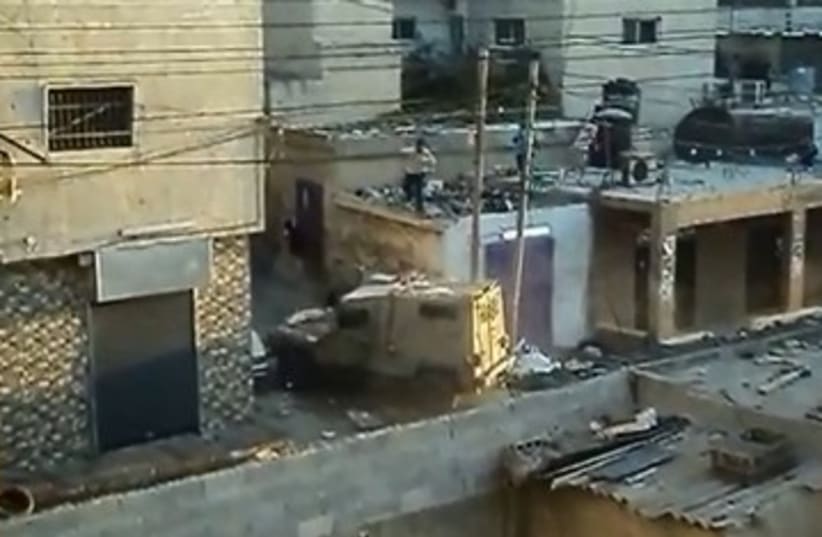 IDF clashes with Palestinians in Kalandiya 370 (photo credit: YouTube Screenshot)