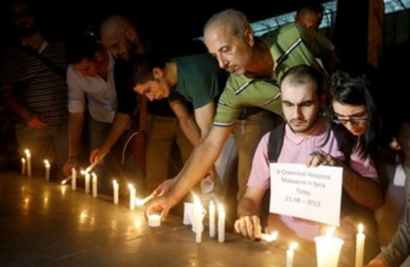 syrian mourn those killed in chemical weapons attack 370 (photo credit: REUTERS)