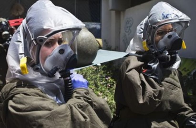 The IDF Home Front Command drills gas a chemical weapons attack against Israel in 2013. (photo credit: REUTERS)