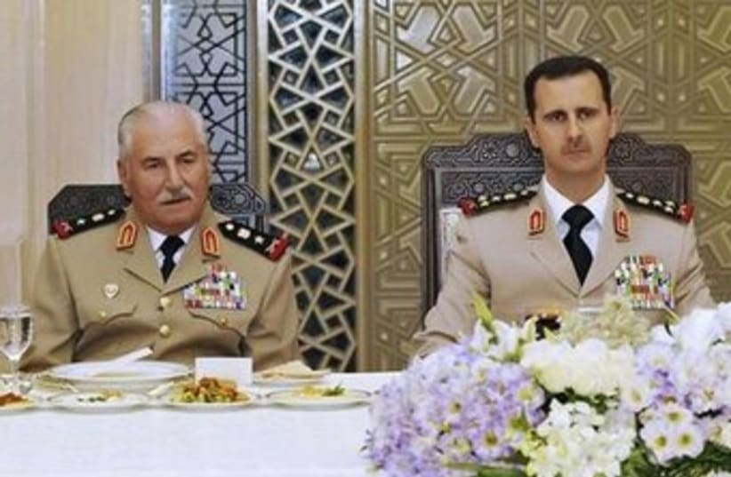 Assad and former Syrian defense minister Ali Habib 370 (photo credit: REUTERS/Sana)