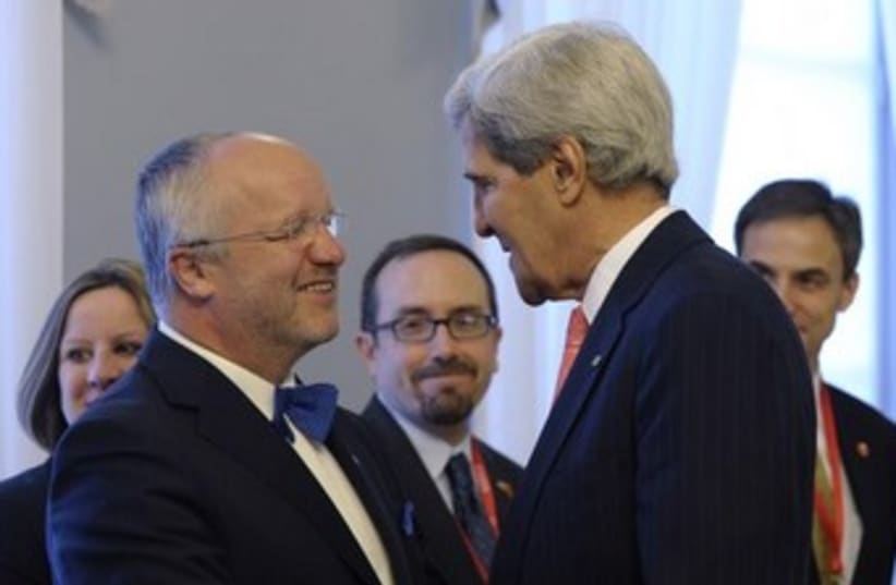 Kerry is greeted by Lithuanian Minister of Defense 370 (photo credit: REUTERS)