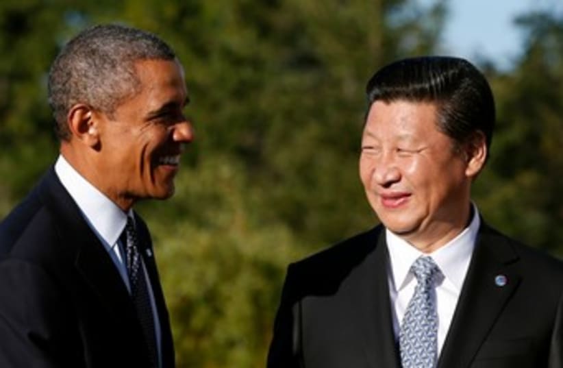 Obama shakes hands with China's President Xi Jinping 370 (photo credit: Reuters)