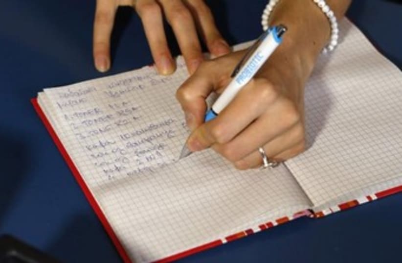 hand writing 370 (photo credit: REUTERS)