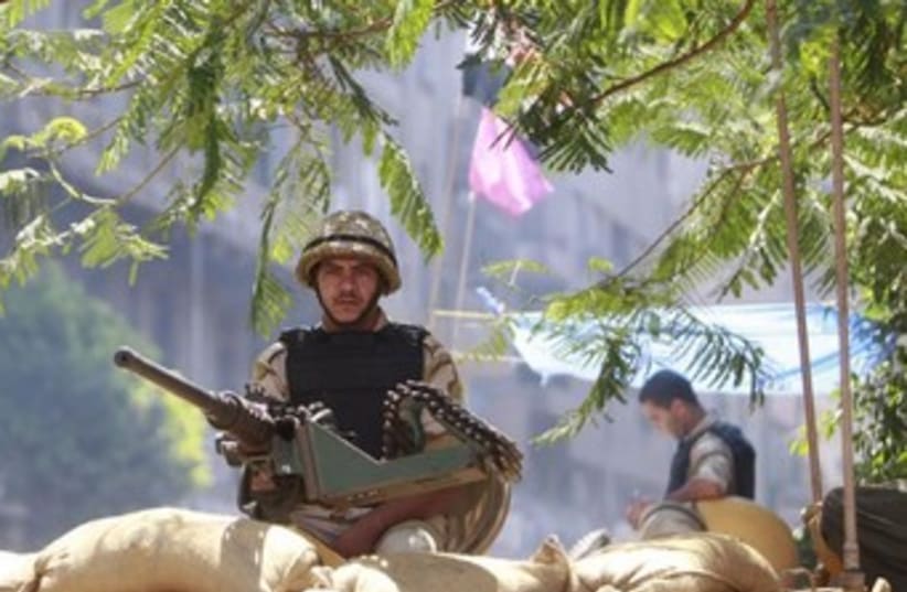 A egyptian soldier mans a machine gun 370 (photo credit: REUTERS)